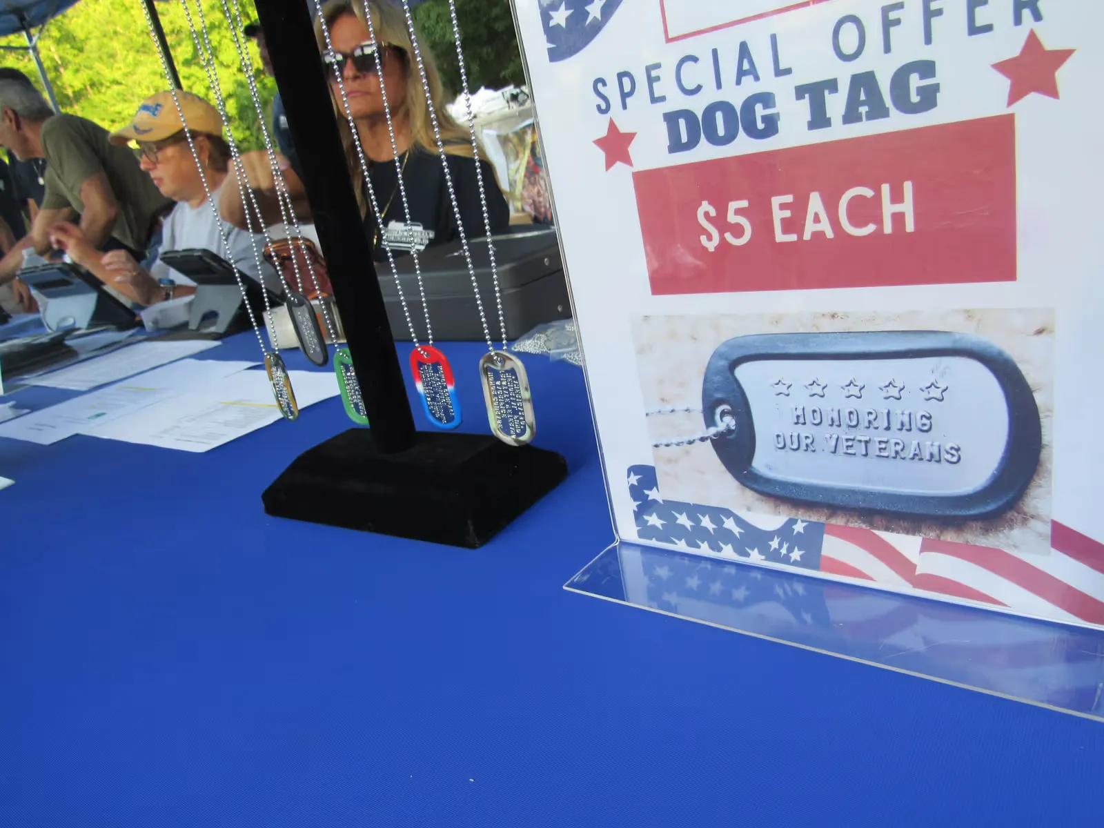 Commemorative dog tags on the merchandise table
