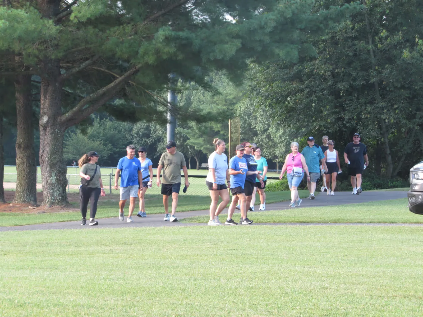 Walkers make their way around the lake