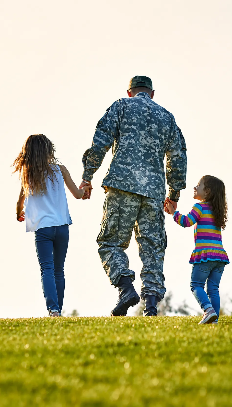 A veteran walking with his children